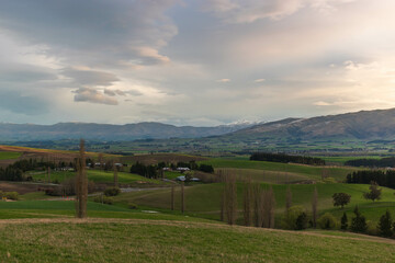 Picturesque Rural Farmland and Mountainous Backdrop