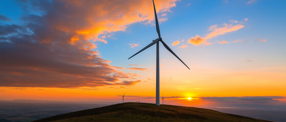 Obraz premium wind turbine farm on hill during vibrant sunset, showcasing renewable energy and scenic beauty
