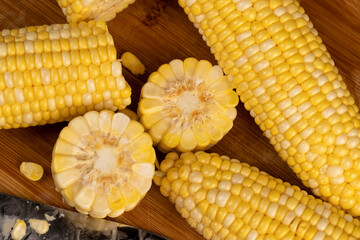 pieces of sweet corn for cooking and cooking with juicy yellow grains