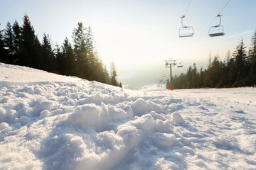 Traces of a snowcat on the ski slope.