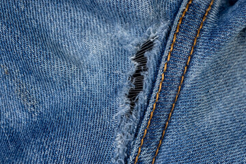 details of old torn jeans from frequent wear