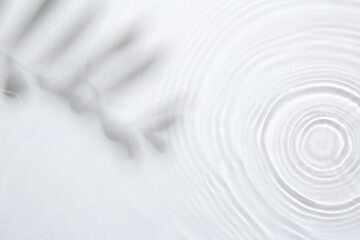 Rippled surface of clear water on white background, top view