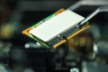 Wi-Fi card on blurred background, closeup. Electronic engineering