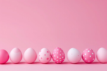 Fototapeta premium Delicate colorful easter background with a row of easter eggs on a pink background