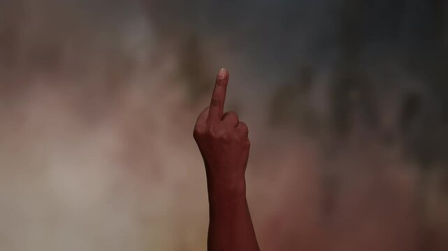 Angry young woman giving the middle finger to camera