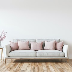 A white sofa with pink pillows in a minimalist living room with wood flooring