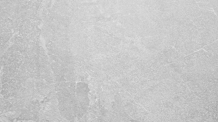 A gray wall with a white paint. The wall is very plain and has no decorations. The wall is made of concrete. white gray texture background for template, page or web banner