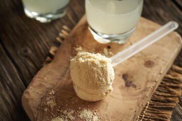 Whey protein powder in a measuring cup