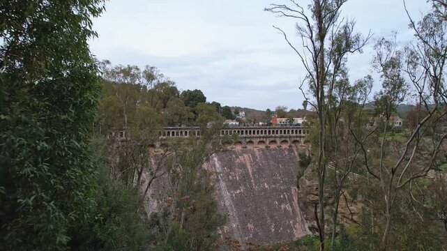 Dry Conde De Guadalhorce Dam Surrounded by Vibrant and Lush Greenery in Andalusia Spain