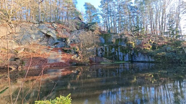 Flooded stone quarries near Lipnice nad Sazavou offer clear turquoise water surrounded by vertical rock walls, a hidden Czech natural landmark and summer retreat.