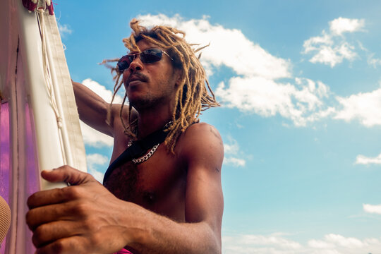 Portrait of a male with dreadlocks on a boat on Seychelles
