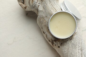 Natural solid perfume in container and snag on white background, top view. Space for text