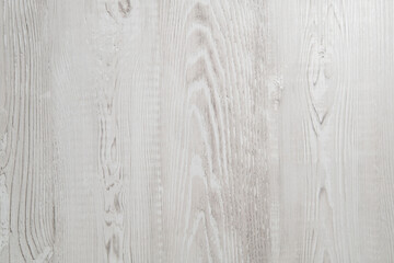 Light-colored wooden surface showcasing natural grain patterns and textures suitable for various design projects