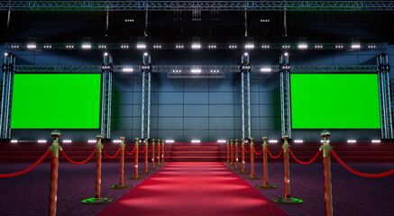 red carpet with golden barriers leading to a big green stage, emty stage