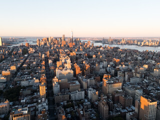 An aerial photo of Manhattan's downtown from above during the sunrise. New York, USA.