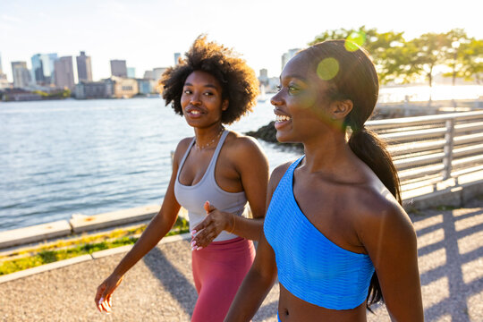 Active healthy teen black athlete together  walk and talk in park