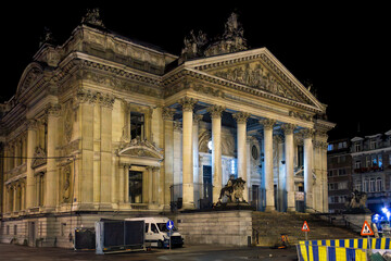 Late night view of the facade of the historic Brussels Stock Exchange building founded in 1802 by Napoleon in the  Place de la Bourse, or Beursplein, in Brussels Belgium. 