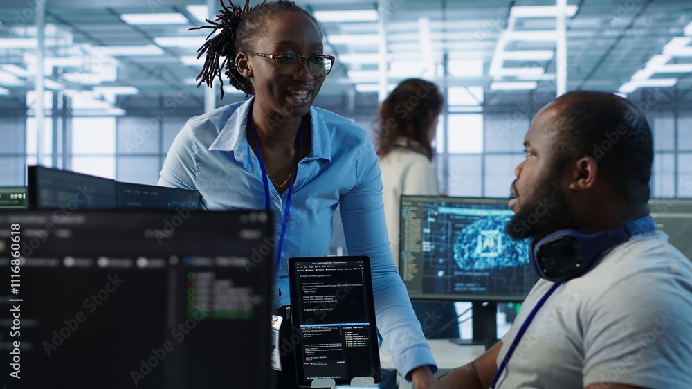 Poster system administrator working with colleague in data center providing computing resources for differe
