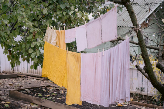 Multiple fabric pieces hanging on clothesline