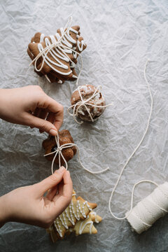 Wrapping a decorated cookie on crumpled paper.