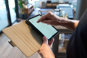 Building Inspector using a tablet to record findings at inspection