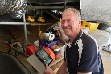 Building Inspector in subfloor area of house during inspection