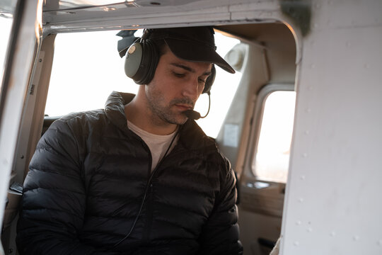 Pilot of a small  aircraft conducting preflight preparations