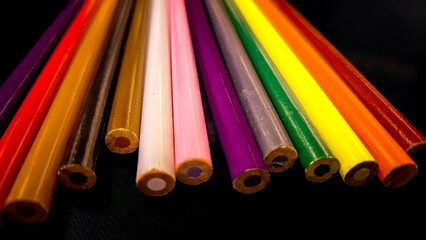 color pencils on black background