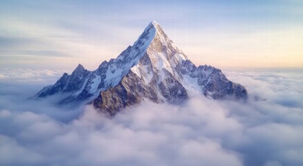 Fototapeta premium Majestic snowy mountain peak above the clouds