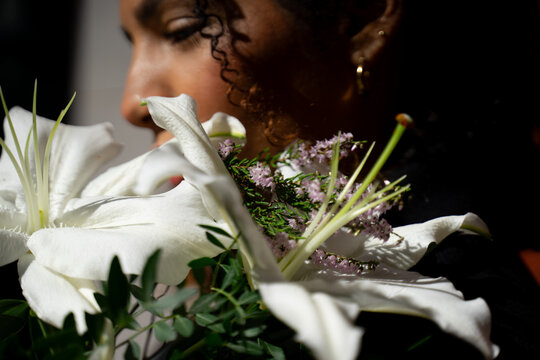 Woman With Curly Hair And Flowers