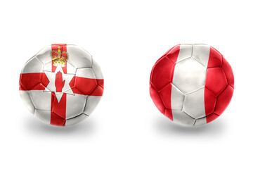 Obraz premium football balls with national flags of northern ireland and peru ,soccer teams. on the white background.