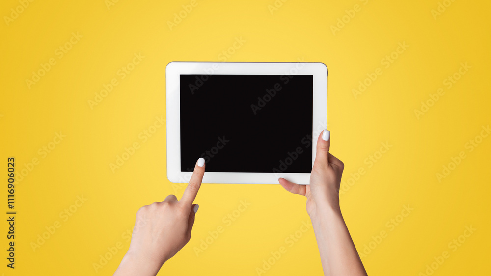 Poster millennial woman touching empty screen of tablet device on light background, close up. space for des