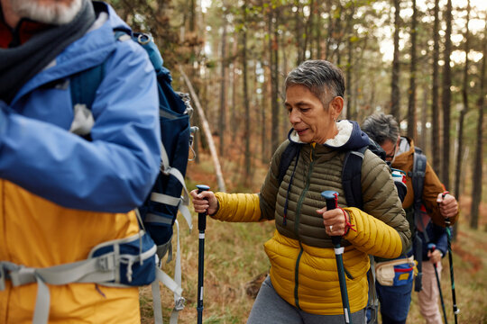 Group of people trekking through the woods