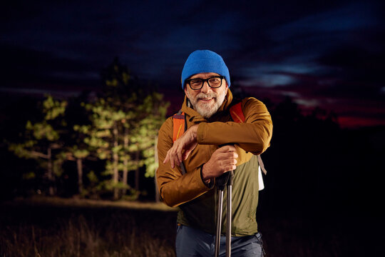 Portrait of a smiling hiker at dusk