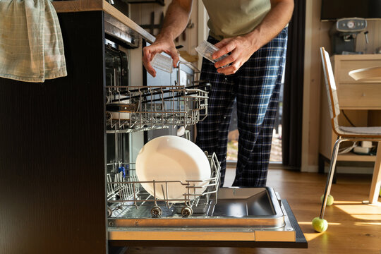 Man Using Dishwasher