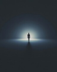 A solitary figure stands in a dark space illuminated by a soft glow.