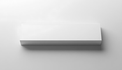 A simple, rectangular white box on a light surface, suggesting packaging or storage.