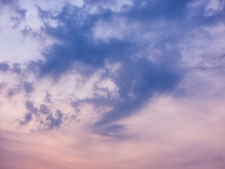 A dramatic, moody sky with swirling clouds in shades of purple and pink. Perfect for backgrounds or to evoke a sense of mystery and emotion