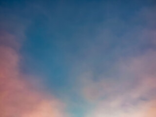 A soft, dreamy sky with a gradient from blue to pink. Perfect for backgrounds or to evoke a sense of nostalgia and peace
