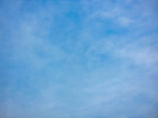 A soft, blue sky with delicate, wispy clouds. Perfect for backgrounds or to evoke a sense of serenity