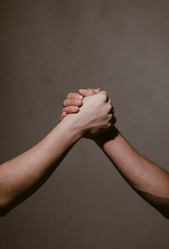 Hand Gesture. Concept of confrontation, competition. Giving respect or approval. Teamwork and friendship. Partnership concept. Man giving fist bump. Bumping fists together.