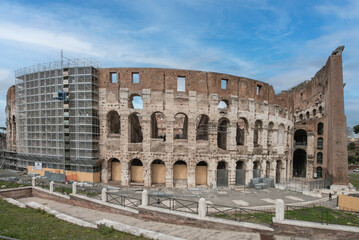 Obraz premium The Colosseum or Coliseum, is an elliptical amphitheater built of concrete and stone, built under the emperor Vespasian in 72 AD and completed in 80 AD, an iconic symbol of Imperial Rome. Italy, 2017