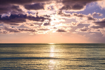 Naklejka premium Sea sunset with sky. Ocean and sky background. Nature sky and sea background for banner. Scenic seascape. Ocean water. Sunset seascape at sea with cloudy sky.