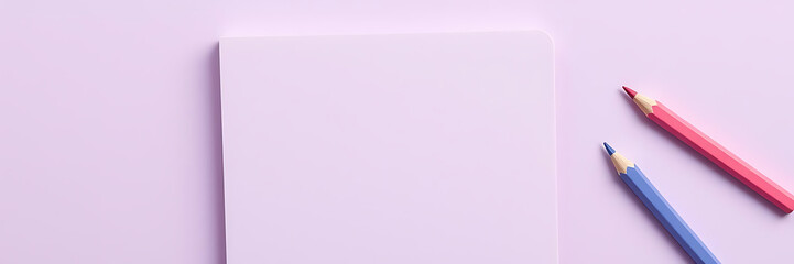 blank notebook with colored pencils on soft violet background, perfect for creative projects and adding text or graphics