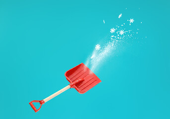 Red Snow Shovel Tossing Snowflakes on Vibrant Teal Backgroun