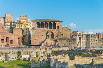 Fototapeta premium Trajan's Market, a complex of ruins at Via dei Fori Imperiali, example of Ancient Roman architecture, the world's oldest shopping mall built in 113 AD by architect Apollodorus of Damascus. Rome, 2017