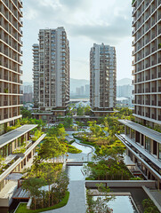 Obraz premium Luxurious Garden Courtyard Surrounded by Modern Twin Residential Towers 