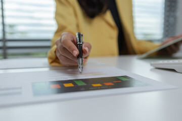 a female executive office working is sitting and working in her private office, a female company owner sits in her company's office, entrepreneur, businesswoman works with a lot of paperwork