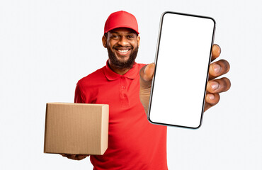 On-Time Courier Service. Delivery Guy Holding Clock And Cardboard Box Standing In Studio Over...