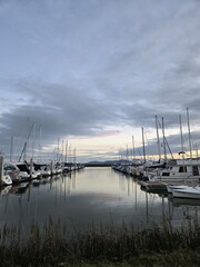 boats by a path during sunset 